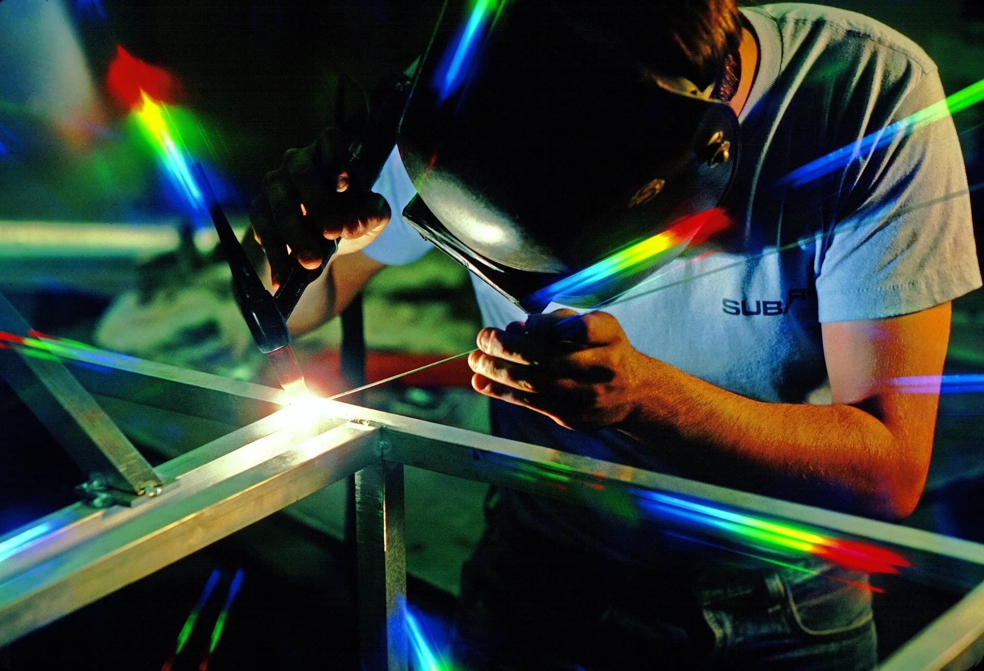 Welder at work in a manufacturing workshop